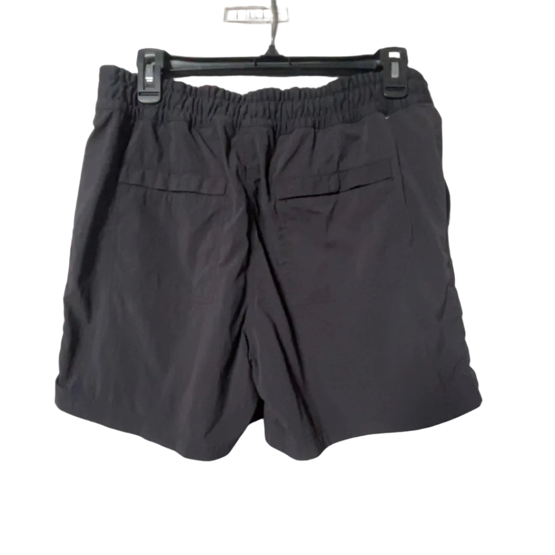 REI charcoal hiking shorts back view with snap pockets and elastic waistband, size Medium