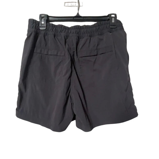 REI charcoal hiking shorts back view with snap pockets and elastic waistband, size Medium