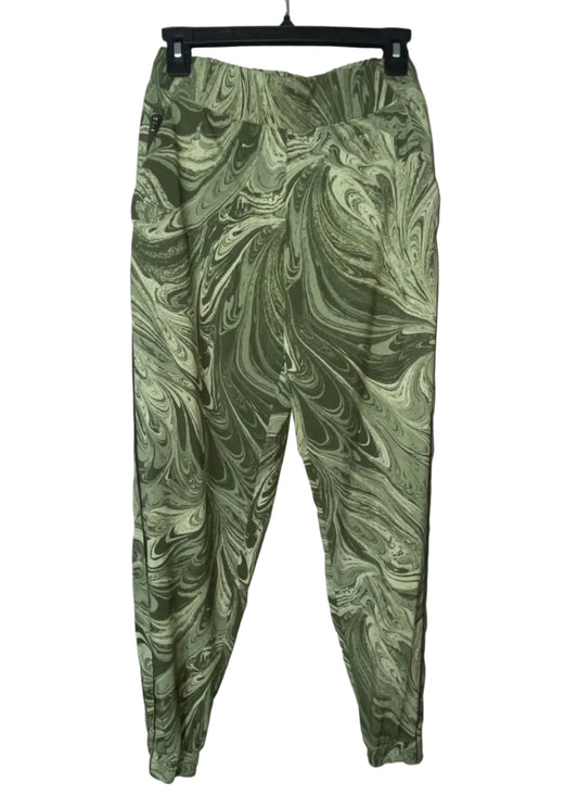 Athleta green marble swirl print jogger pants front view with side zipper pocket, size 6