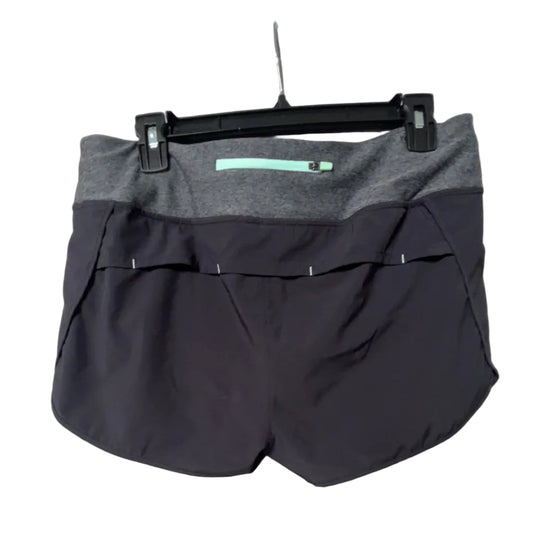MPG navy and grey running shorts back view showing teal zipper pocket on waistband, size Medium