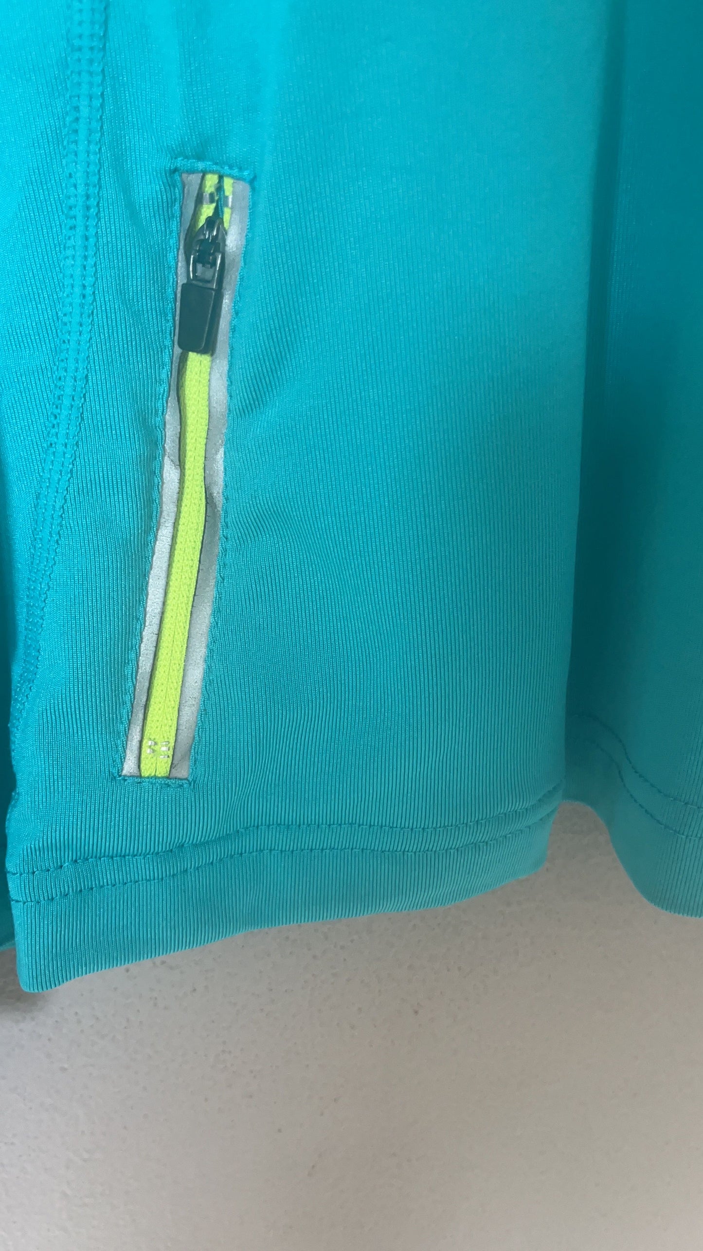 MPG Quarter-Zip Pullover - Side Zip Pocket Detail