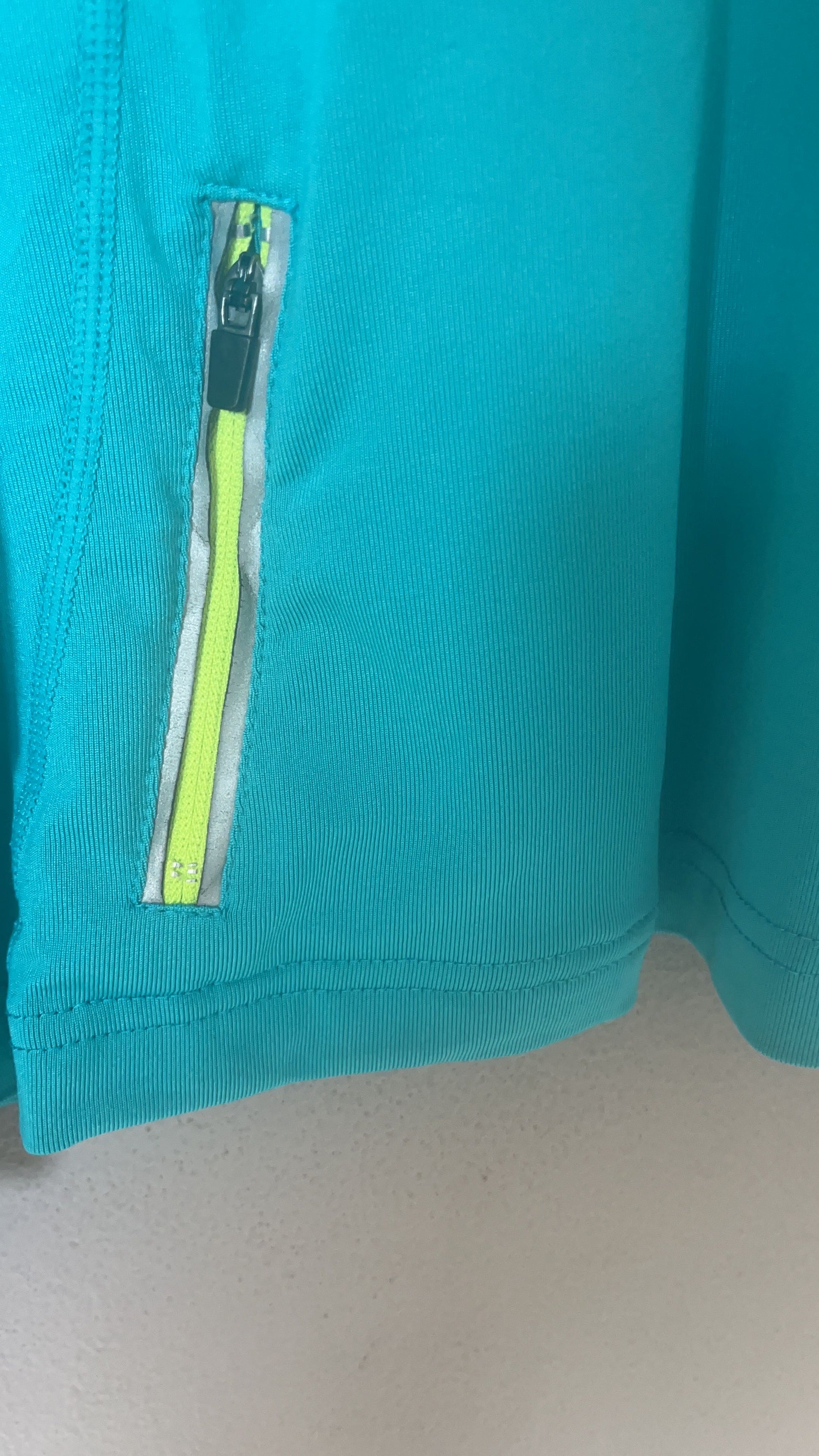 MPG Quarter-Zip Pullover - Side Zip Pocket Detail