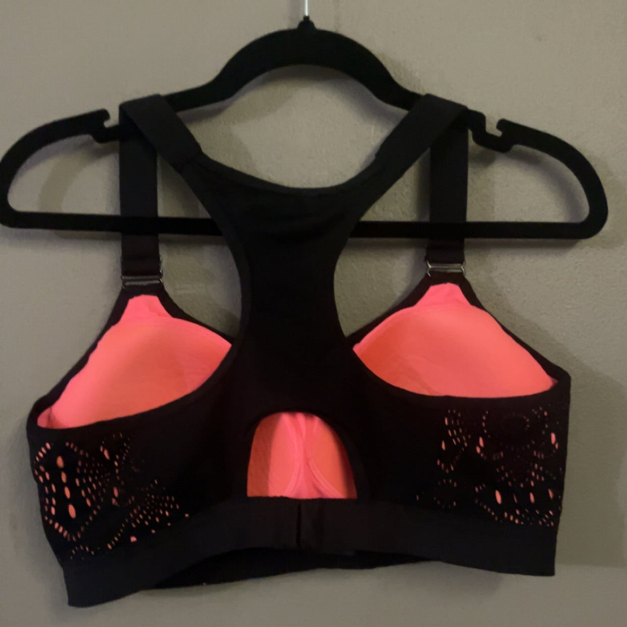Yvette black and pink sports bra back view showing racerback and cups