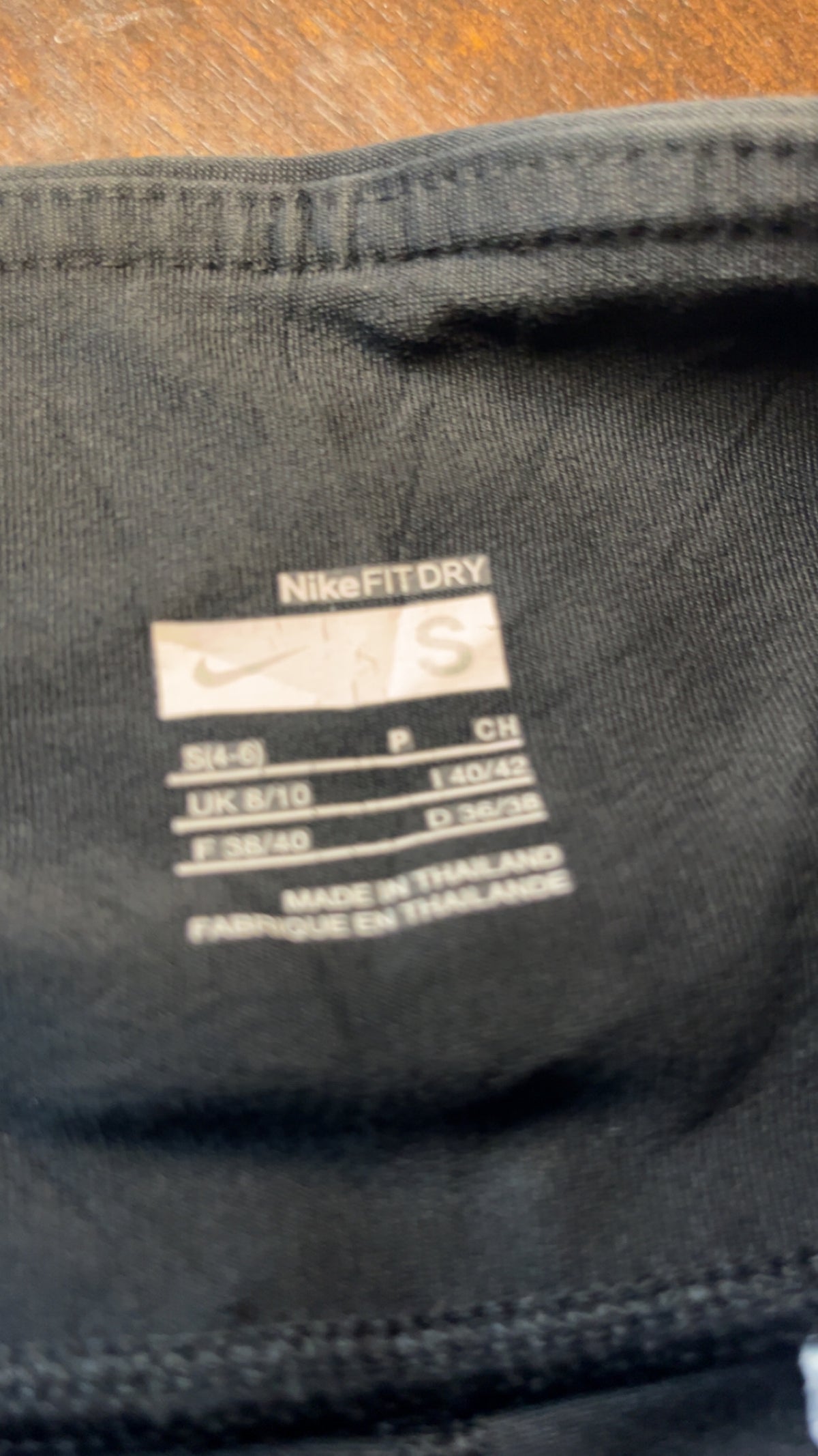 Back view of black Nike Dri-FIT flare training pants
