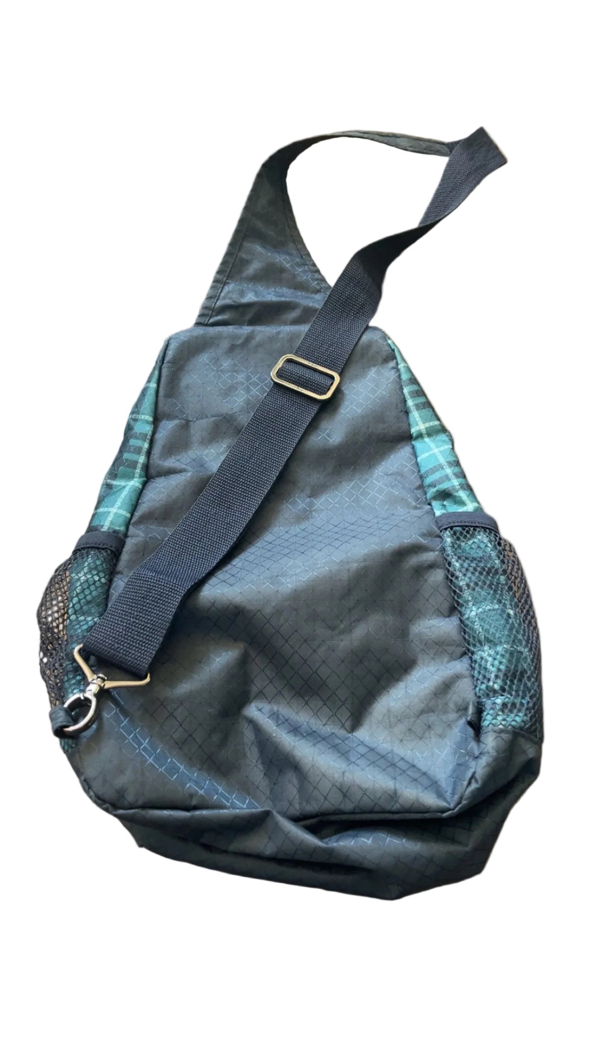 Back view showing pockets on black and teal plaid Thirty-One sling bag