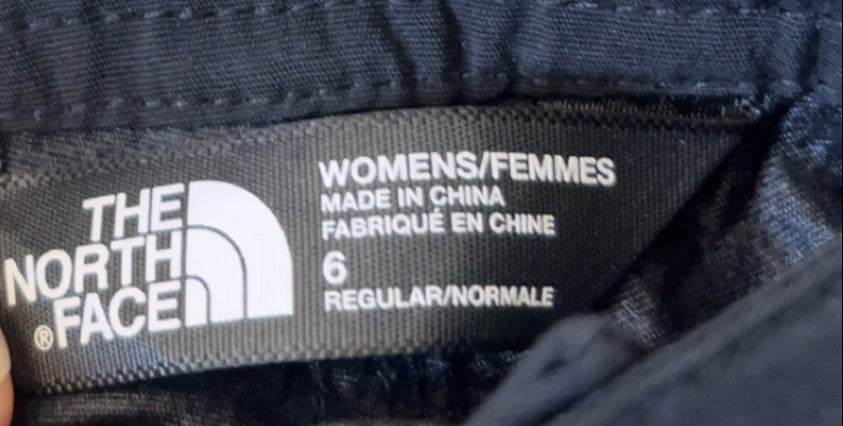 Front view of black The North Face ripstop hiking shorts