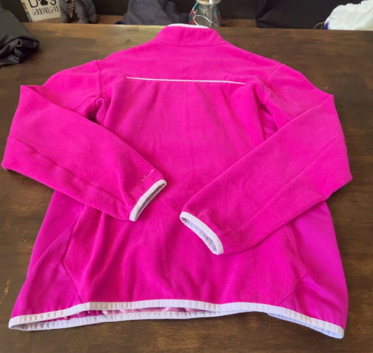 Close-up of Columbia Omni-Heat label and fleece lining on pink pullover