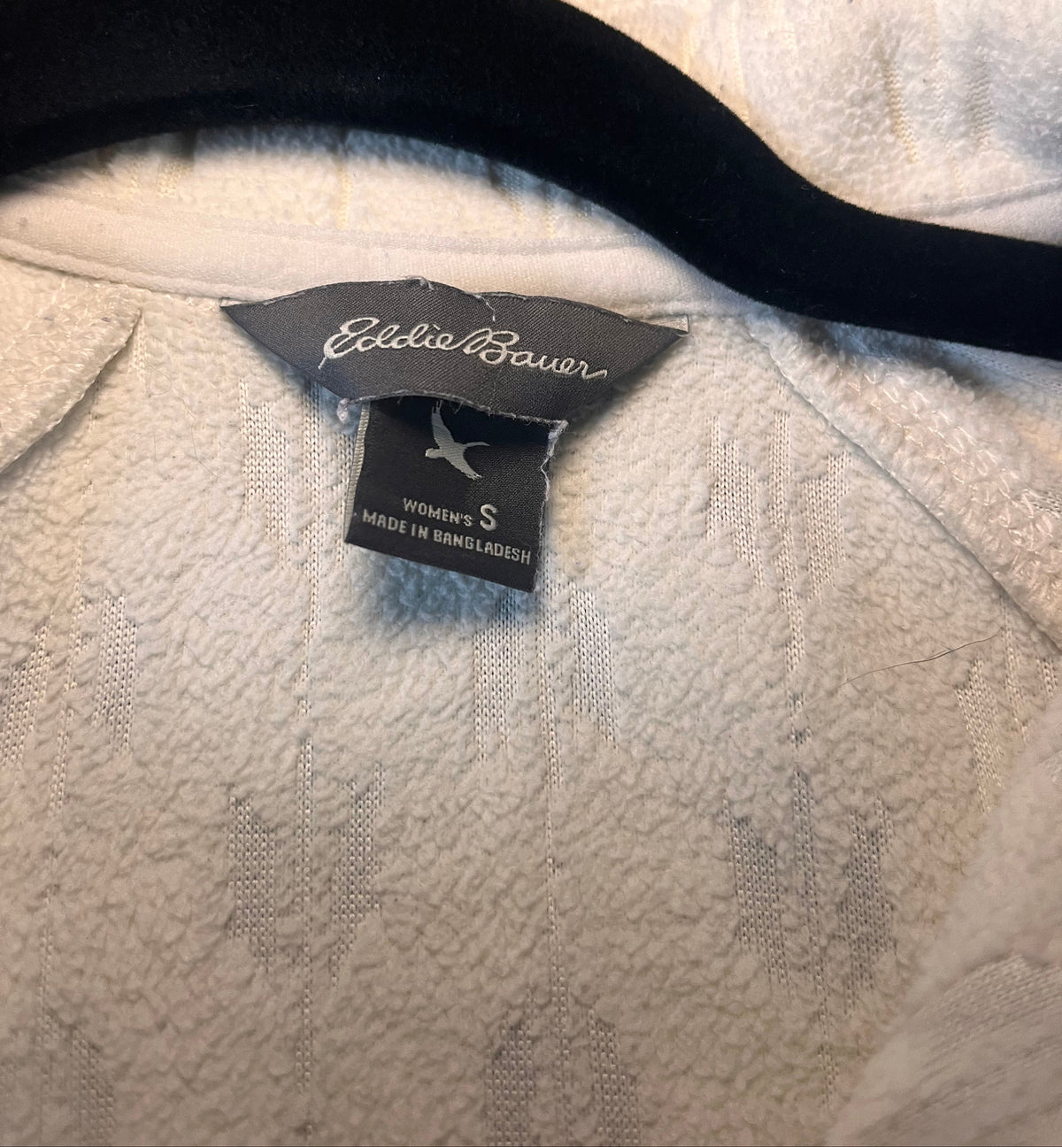 Back view of ivory Eddie Bauer textured quarter-zip pullover