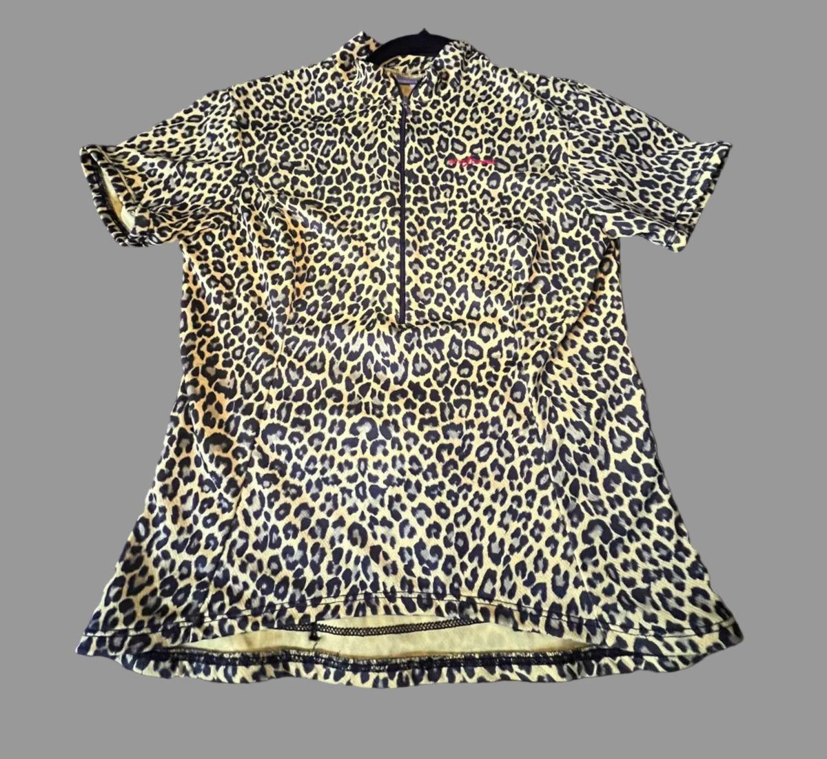 Front view of Shebeest leopard print cycling jersey in size Small